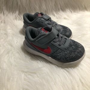 Gray and red Nike